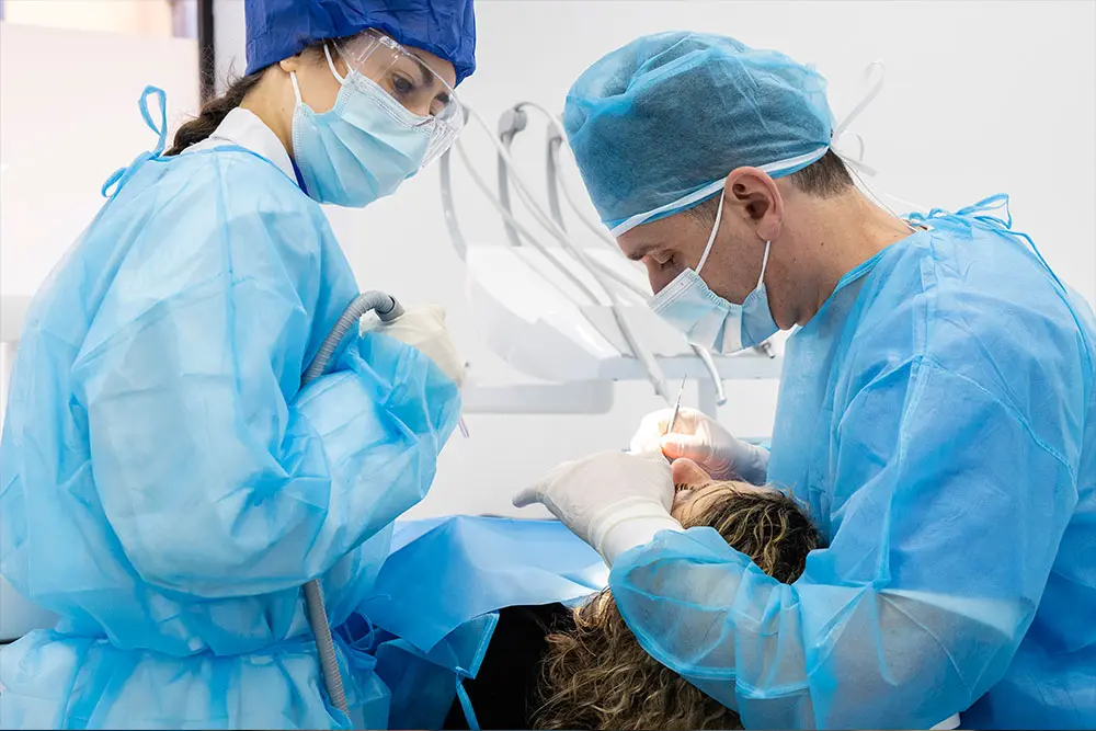 Two clinicians operating together on a patient during a one-to-one session