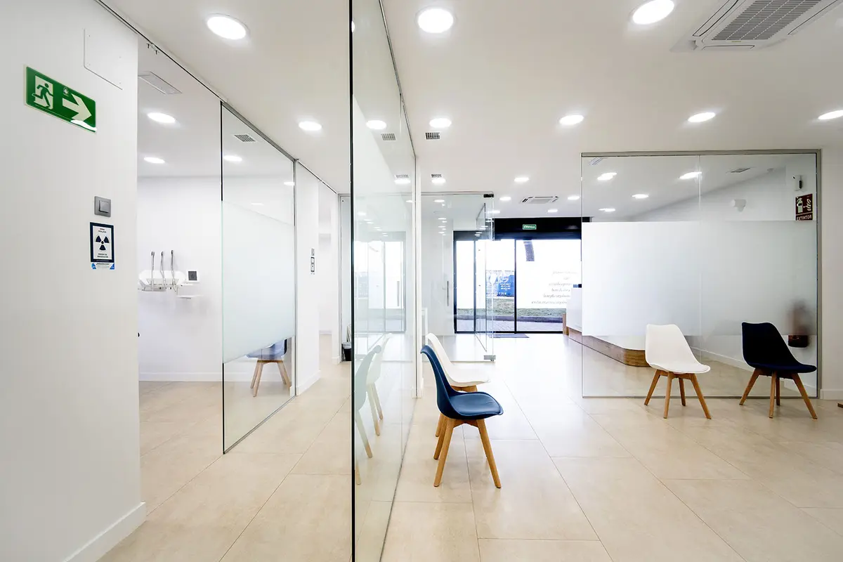The corridor of the centre, with glass partitions and the waiting area
