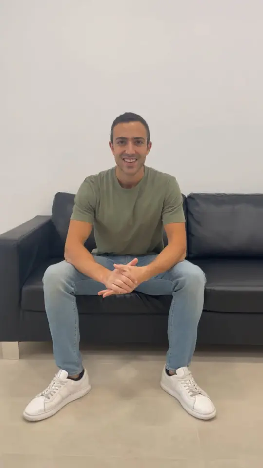 A clinician sitting in the clinic, talking to camera about the training