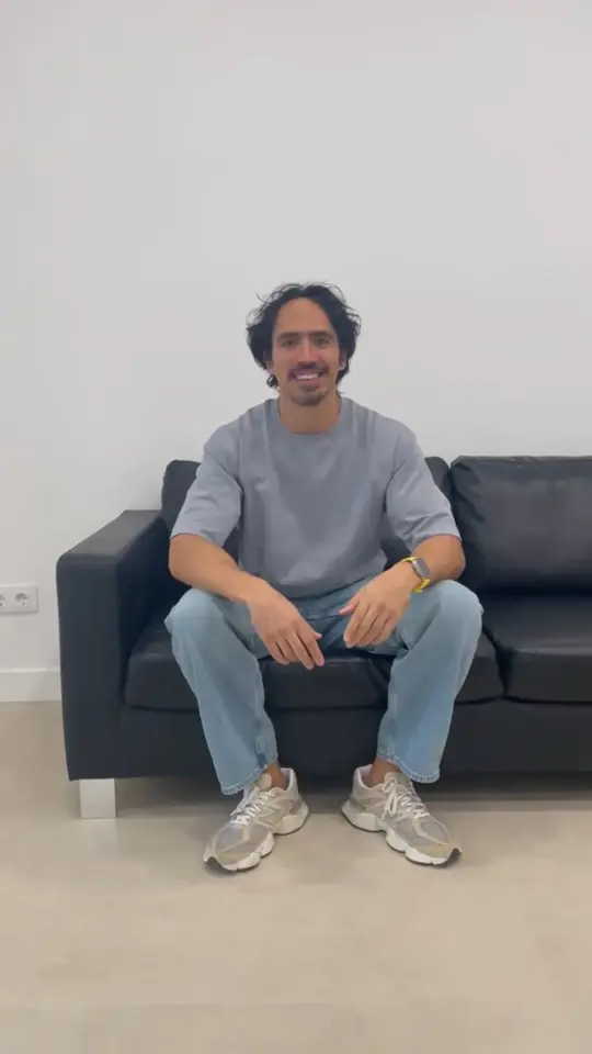 A clinician sitting in the clinic, talking to camera about the training