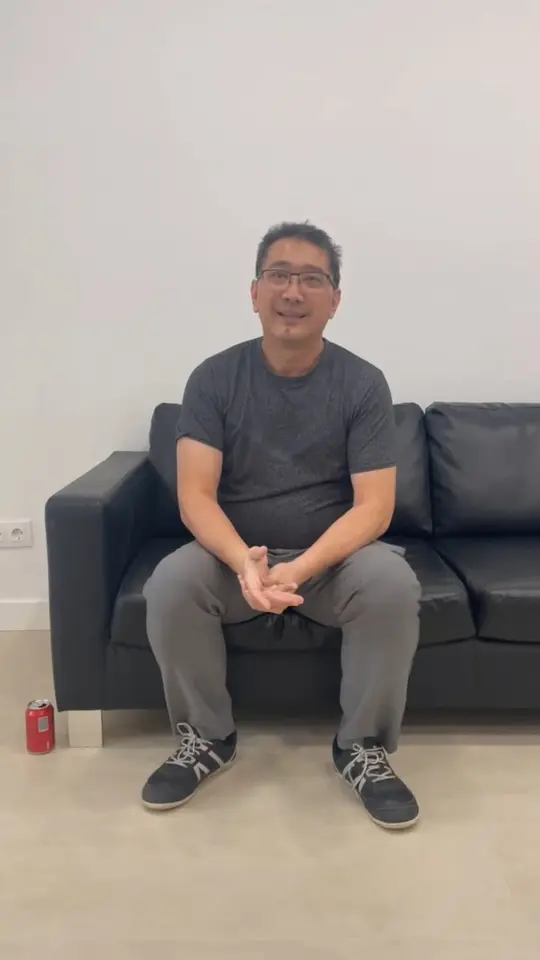 A clinician sitting in the clinic, talking to camera about the training