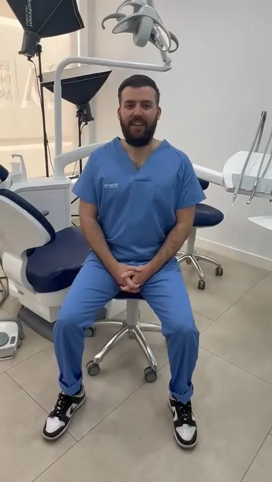A clinician sitting in the clinic, talking to camera about the training